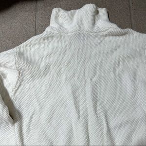 white cropped turtle neck sweater with bell sleeves